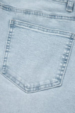 Close-up of a light blue denim pocket