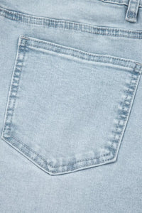 Close-up of a light blue denim pocket