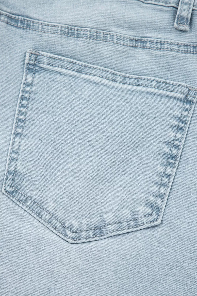 Close-up of a light blue denim pocket