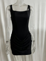 Black dress on a transparent mannequin against a white background