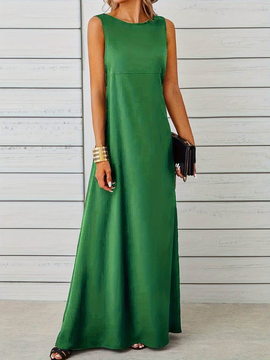 Woman wearing a green sleeveless dress against a wooden background