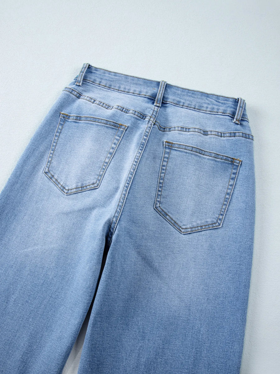 Light blue jeans on a white background