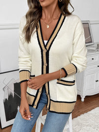 Woman wearing a cream and beige cardigan in a home setting