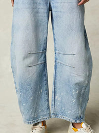 Light blue denim wide-leg jeans on a neutral background