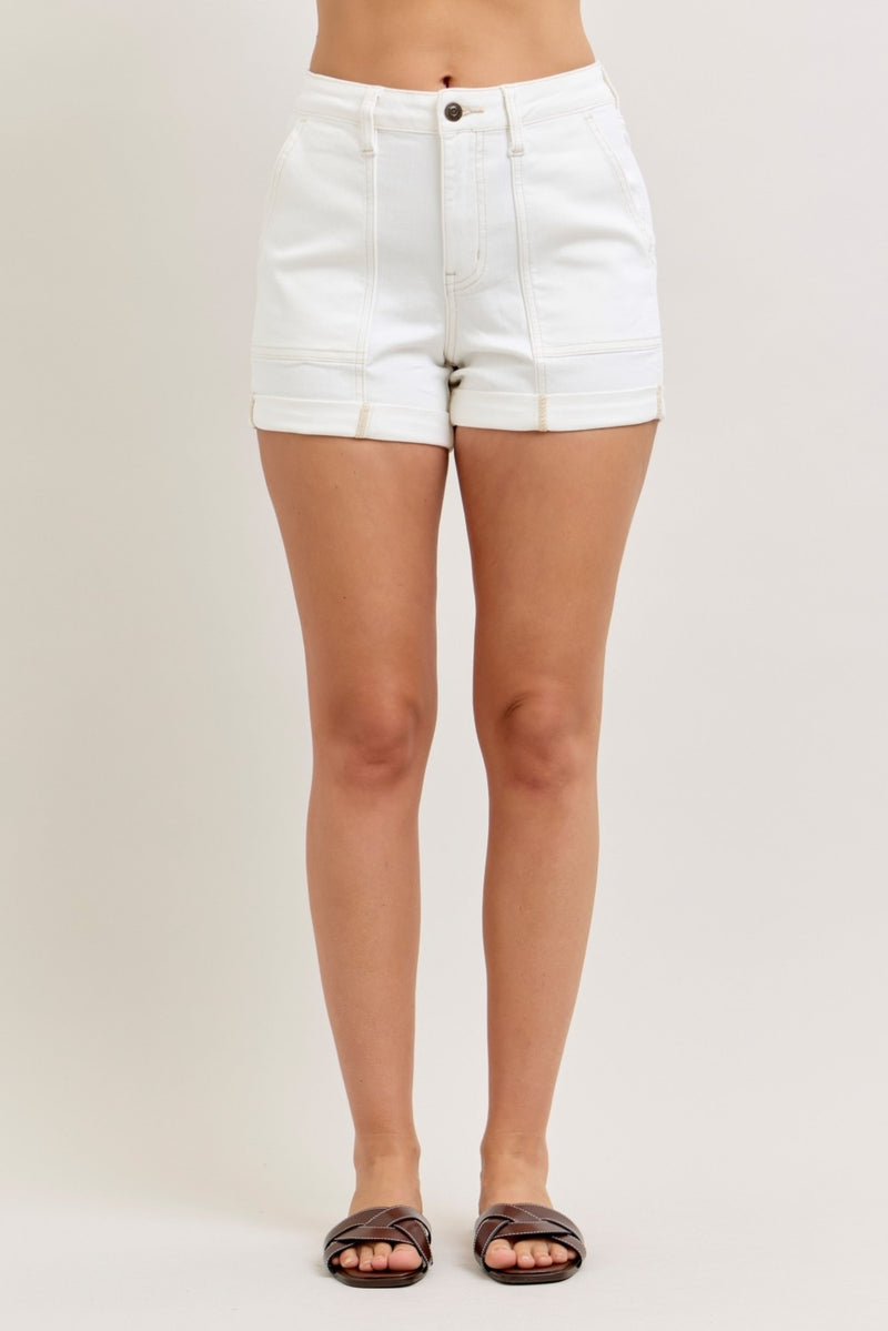 White shorts worn by a person on a plain background
