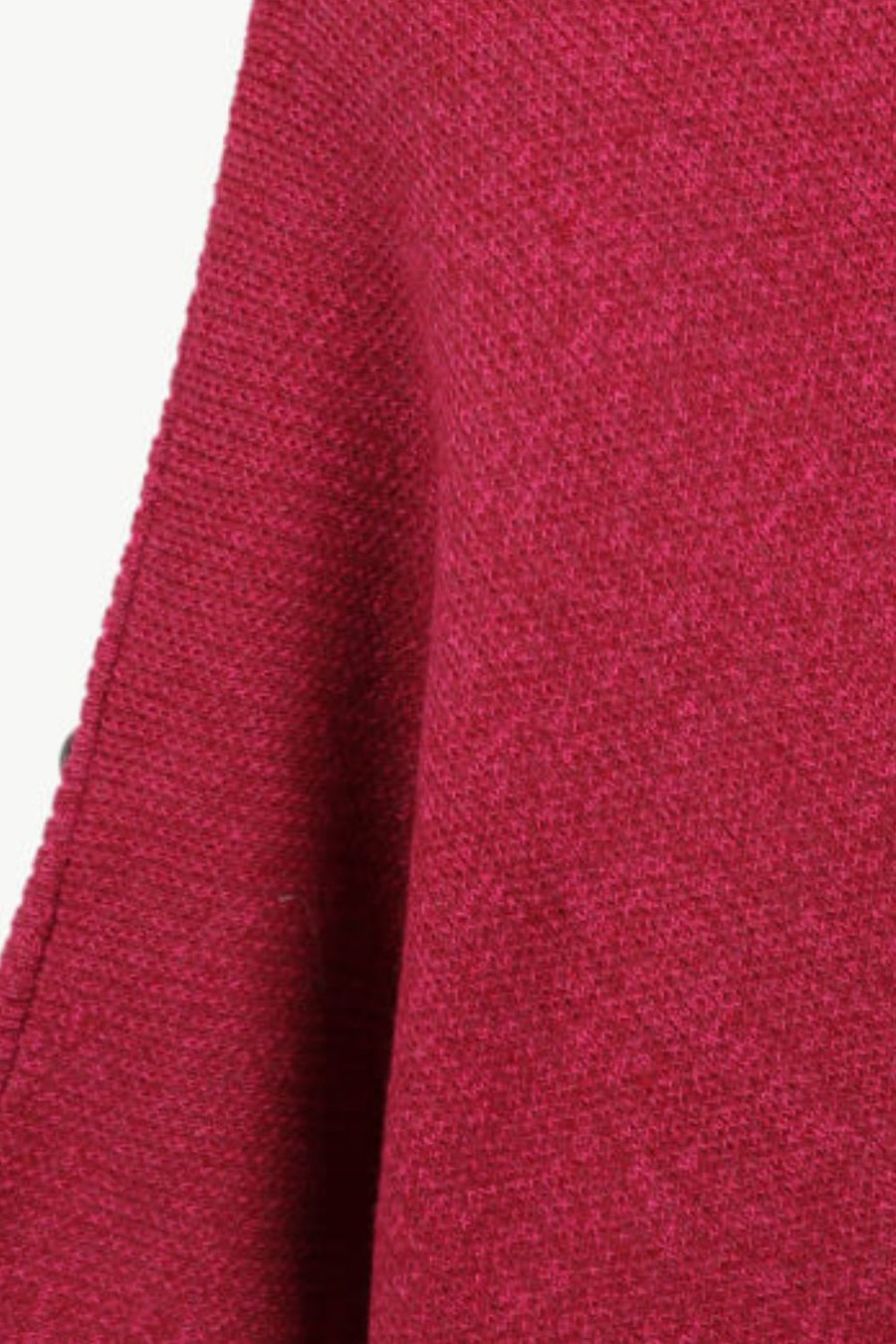 Close-up of a textured red fabric with a white background
