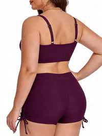 Purple bikini set worn by a model on a white background