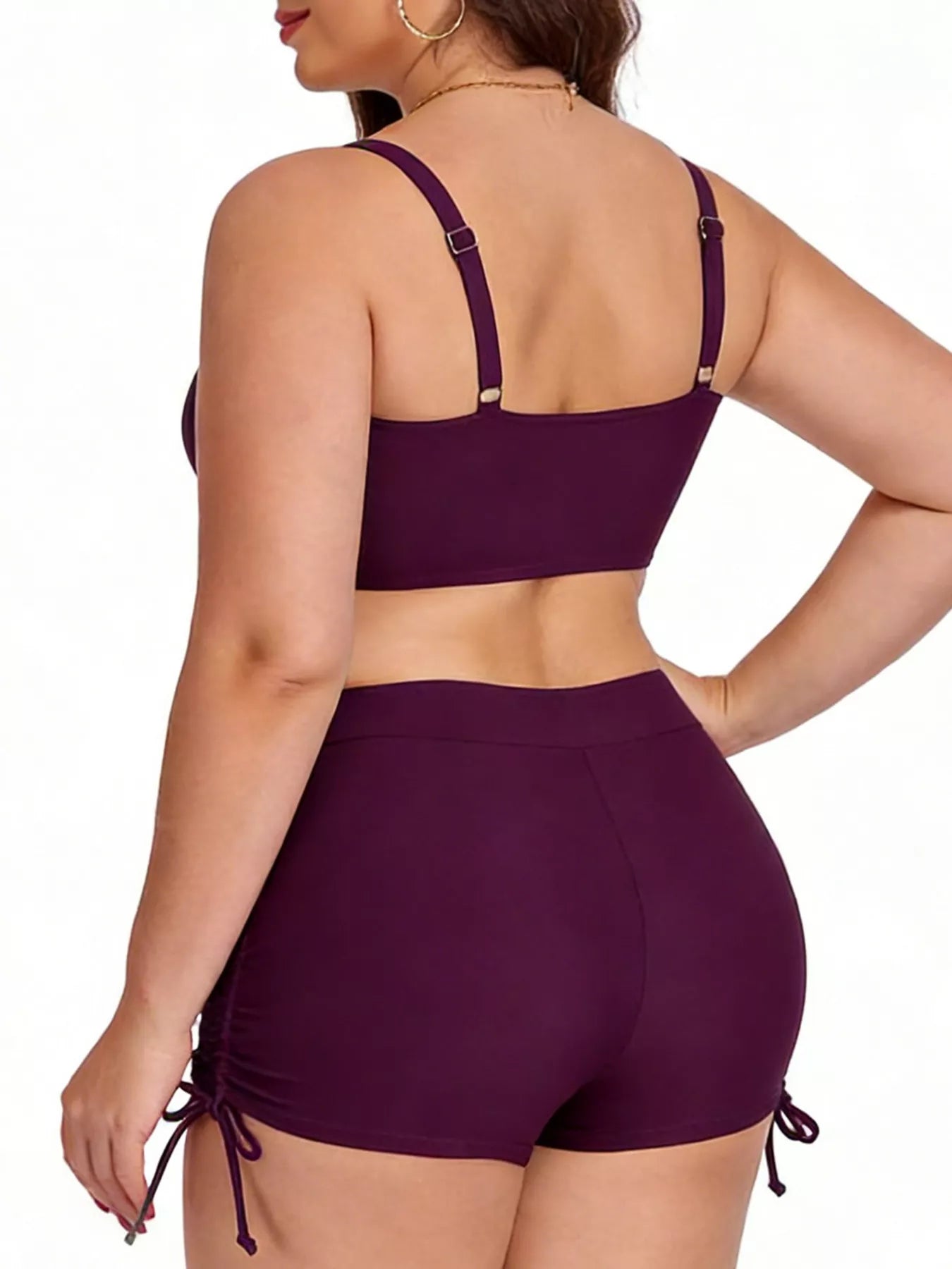 Purple bikini set worn by a model on a white background