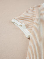 Close-up of a beige and white striped fabric on a beige background