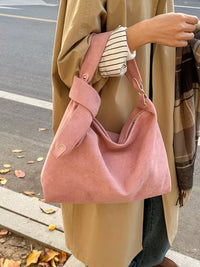 A women carrying Women's Suede Hobo Shoulder Bag