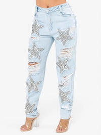 Light blue jeans with star-shaped embellishments on a white background