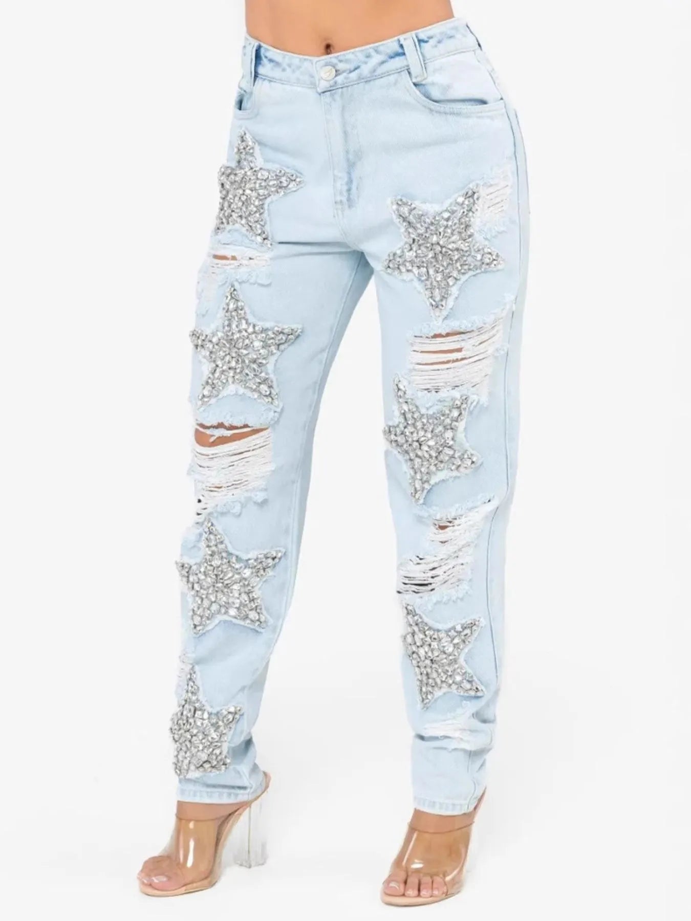 Light blue jeans with star-shaped embellishments on a white background