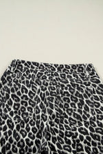Leopard print pants on a light gray background