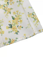 Floral fabric with yellow flowers on a white background
