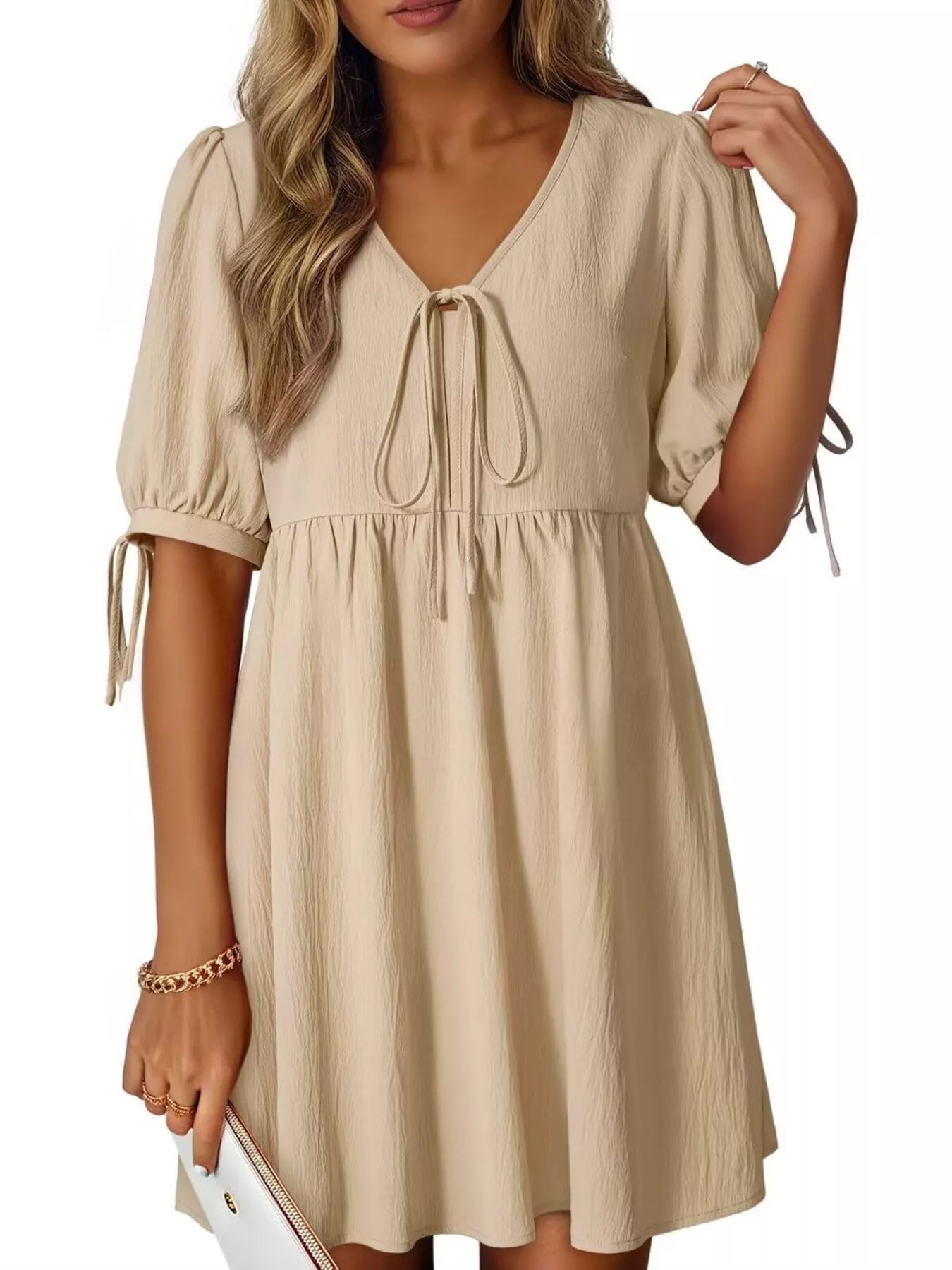 Beige dress with short sleeves and drawstring waist on a white background