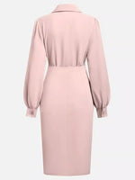 Pink dress with long sleeves on a white background