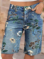 Denim shorts with floral patterns on a blurred background