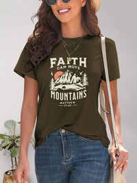 Woman wearing a green t-shirt with 'Faith Can Move Mountains' graphic and text.