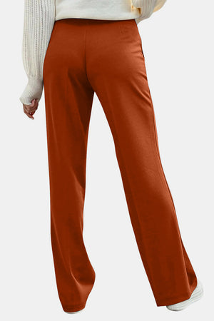 Back view of orange Decorative Button High Rise Pants