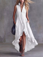 Woman wearing a white sleeveless dress against a gray background