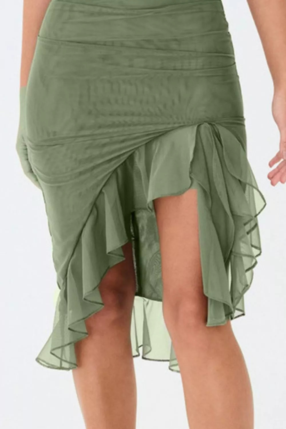 Green skirt with ruffled layers on a white background