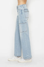 Light blue jeans worn by a person on a white background