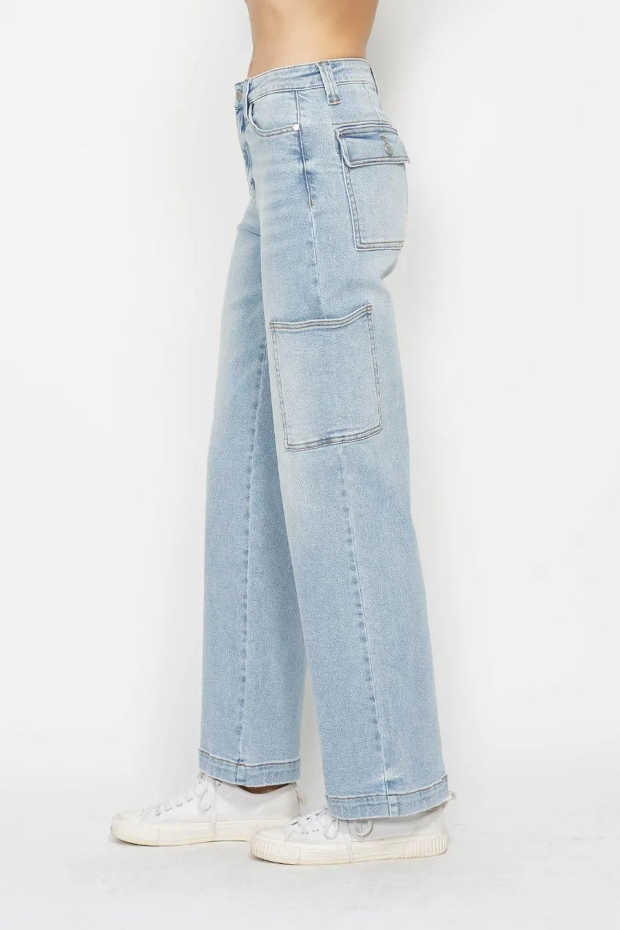 Light blue jeans worn by a person on a white background