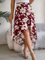 Woman wearing a burgundy floral skirt in an indoor setting