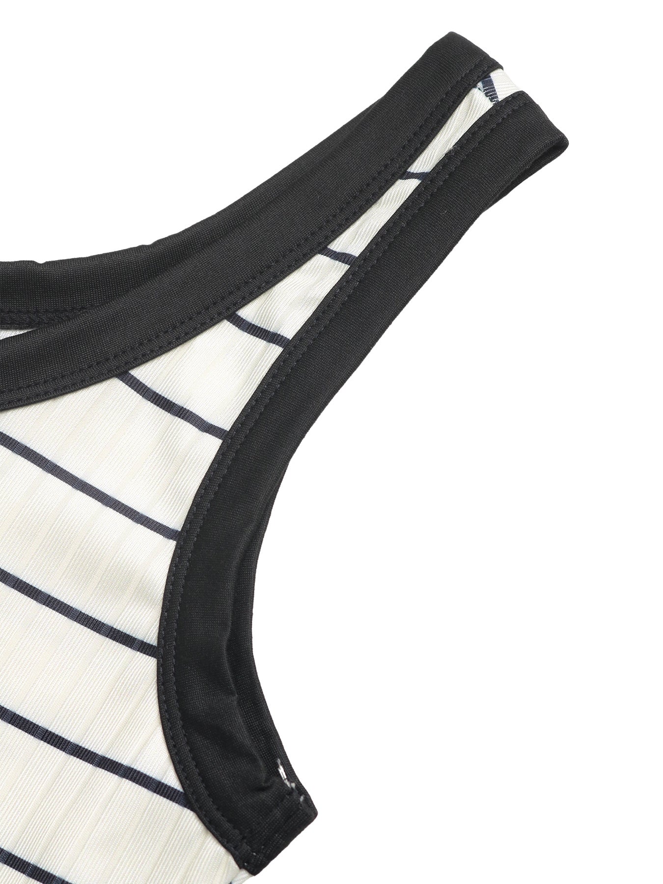 Close-up of a black bikini bottom with a white and navy striped top on a white background