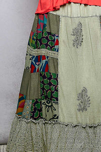 Traditional patchwork skirt with intricate patterns on a plain background