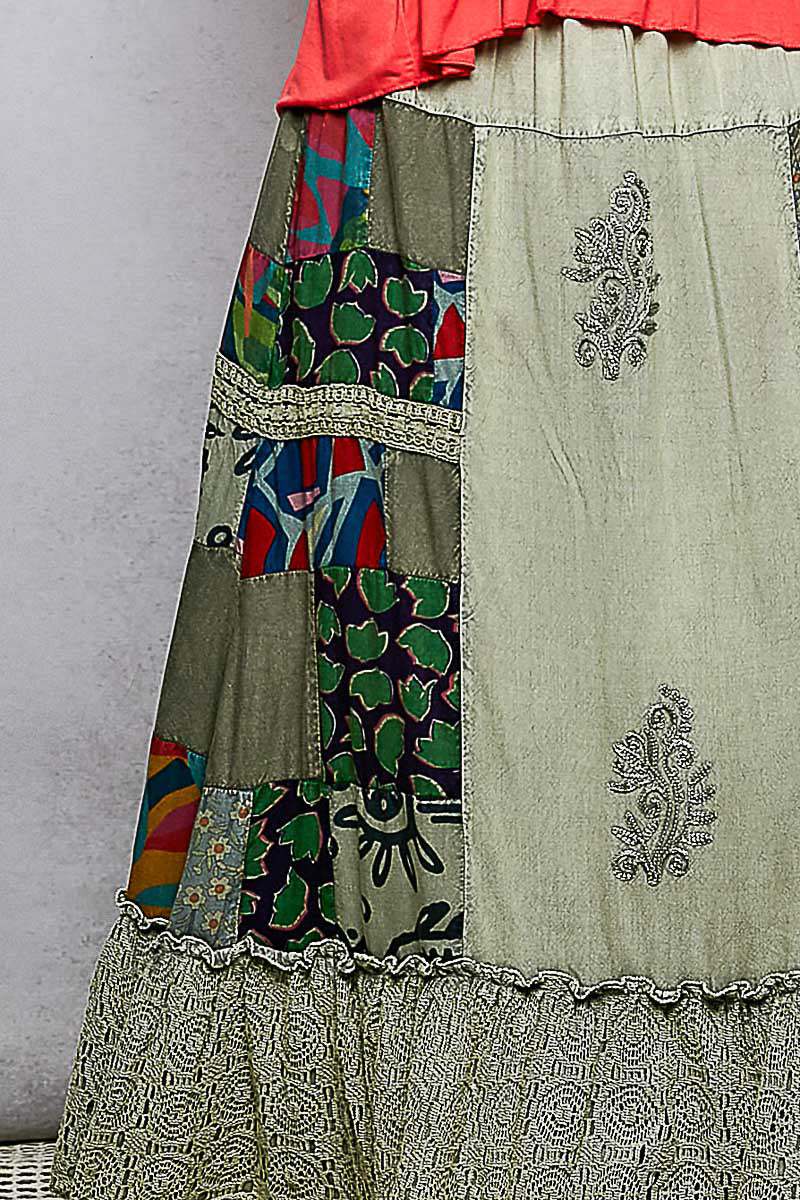 Traditional patchwork skirt with intricate patterns on a plain background