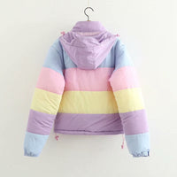 Pastel striped jacket on a hanger against a white background