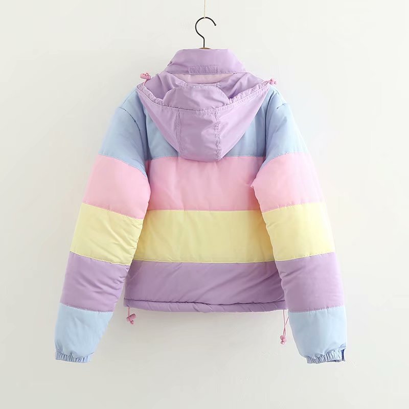 Pastel striped jacket on a hanger against a white background