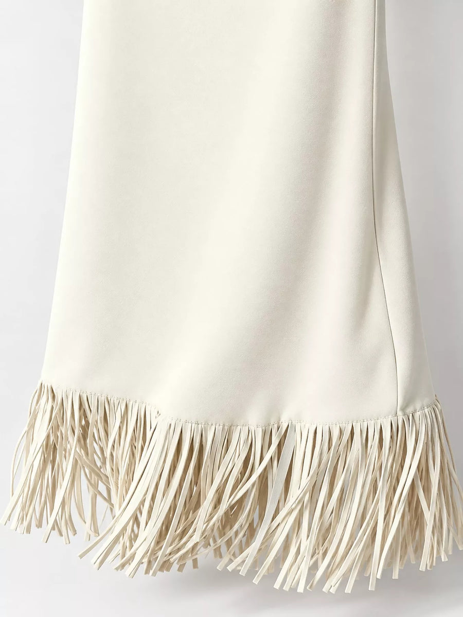 This picture is showing the fringes on the white High-Waisted Fringe Midi Skirt