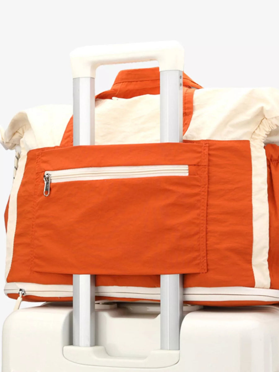 Orange and white folding chair with a white background