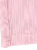 Close-up of a pink textured fabric with a white background