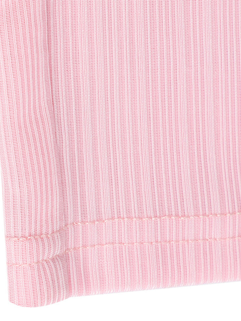 Close-up of a pink textured fabric with a white background