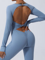 Close up view of blue Twisted Backless Long Sleeve Jumpsuit