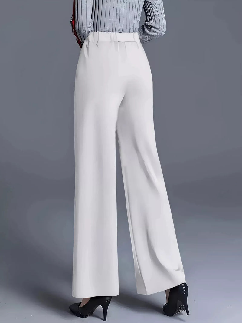 White wide-leg pants worn by a person on a gray background