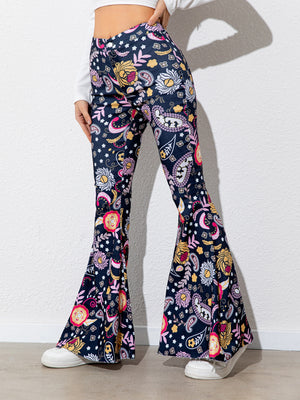 Flared pants with colorful pattern worn by a person on a white background