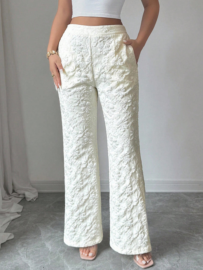 Person wearing textured white pants against a neutral background