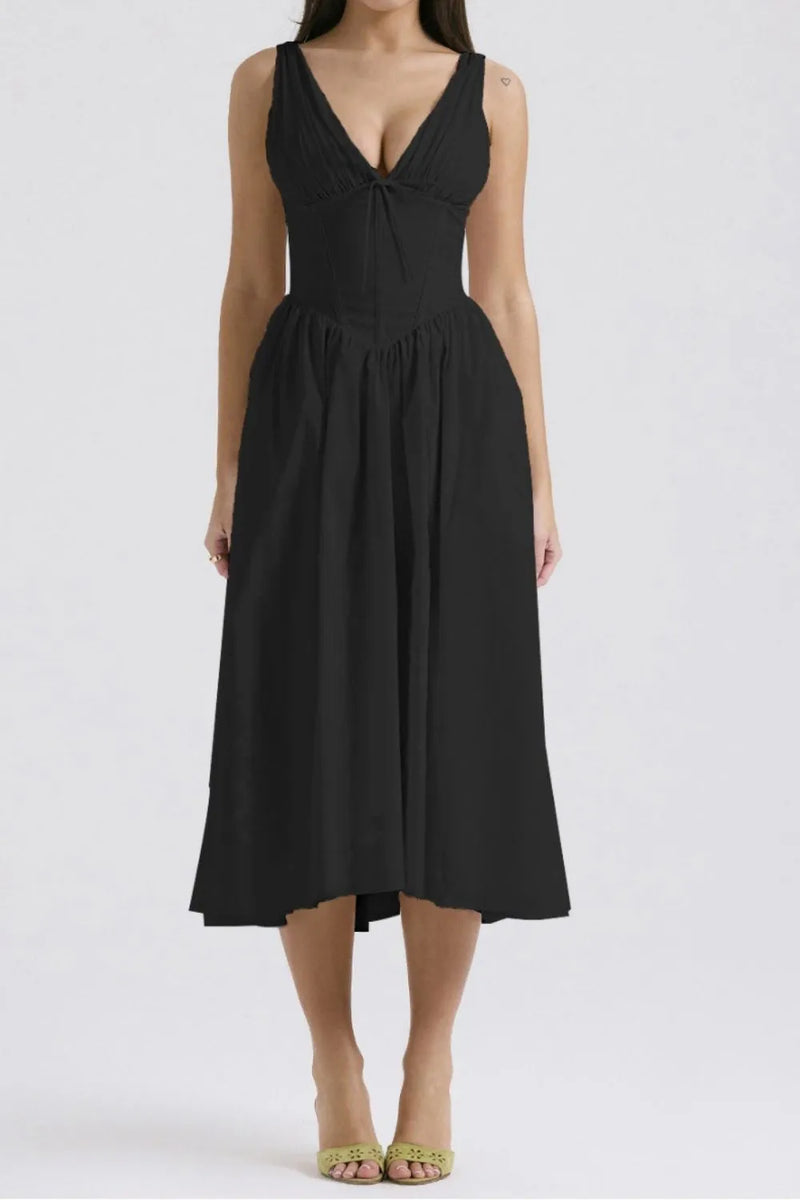Black dress worn by a model on a white background