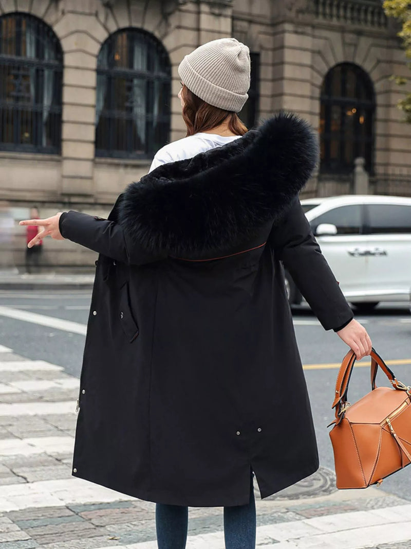 Lady show the back of black Women's Detachable Longline Hooded Parka with Faux Fur Trim and Drawstring Waist