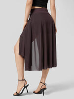 Brown skirt with a high slit worn by a model on a gray background
