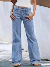 Person wearing light blue wide-leg jeans against a neutral background