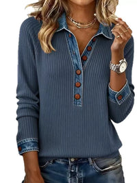 Woman wearing a blue ribbed sweater with denim collar and cuffs on a white background