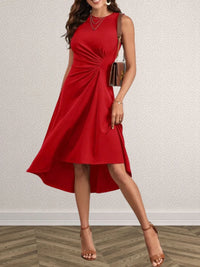 Red dress worn by a model on a plain background