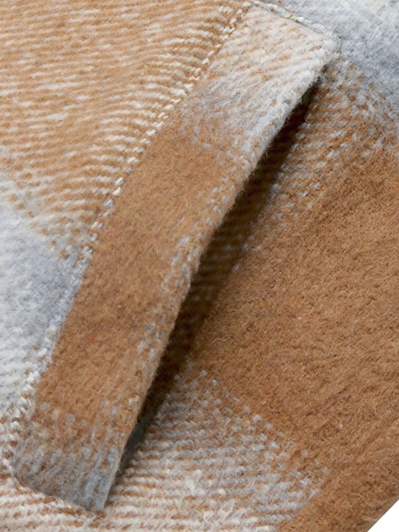 Close-up of a textured fabric with brown and gray pattern
