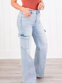 Light blue jeans worn by a person on a white background