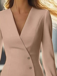 Close-up of a pink blazer with a blurred background